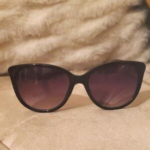 Classic Black Sunglasses With Gold Detail On Side Arms.